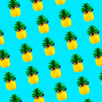 Seamless pattern of pineapples on turquoise background