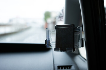 Smartphone car holder installed inside a car. 