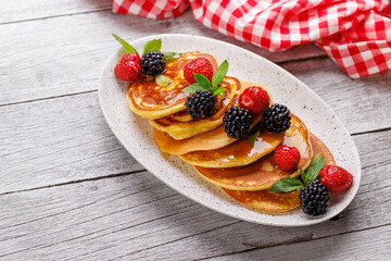 Tasty homemade pancakes with berries