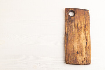 Empty rectangular wooden cutting board on white wooden. Top view, copy space