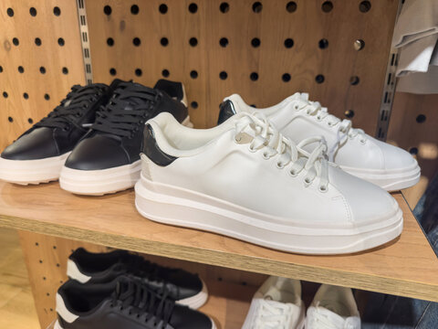 white sneakers, male female shoes on the shop shelf