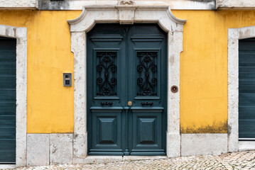 Green door in European neighborhood
