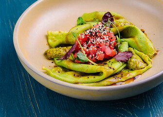 Delicious spinach crepes with tomato salsa