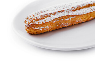 eclair with powdered sugar on a plate
