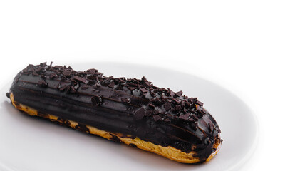 Cake eclair glazed with chocolate cream