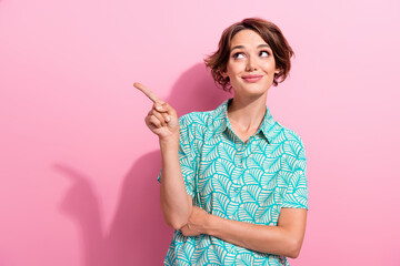 Portrait of stunning positive lady look direct finger empty space proposition isolated on pink color background