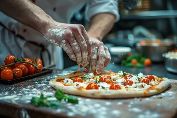 Wandcirkels plexiglas Pizza chef finishing the preparing of in professional pizzeria restaurant kitchen. © jakapong