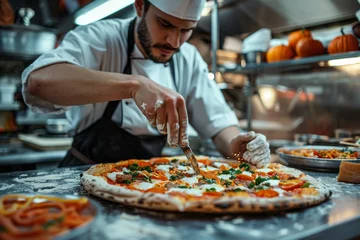 Plexiglas foto achterwand Pizza chef finishing the preparing of in professional pizzeria restaurant kitchen. © jakapong