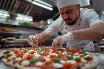 Fototapete Rund Pizza chef finishing the preparing of in professional pizzeria restaurant kitchen. © jakapong
