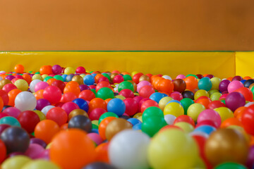 Fototapeta na wymiar holiday, children's party, a games room, a box filled with small colored balls