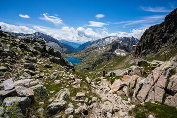 Young hiker girl summit to Montardo Peak in AIguestortes and Sant Maurici National Park, Spain