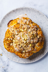 Spicy baked cauliflower with tahini dressing and pistachios.