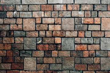 Decorative uneven cracked real stone wall surface.