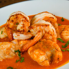 Recipe for Armorican-style monkfish tail, prawns, flambees with cognac, High quality photo