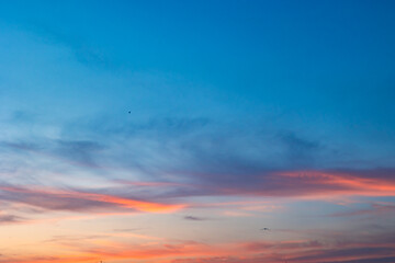 Beautiful partly cloudy sky at sunset or sunrise with pastel colors - obrazy, fototapety, plakaty