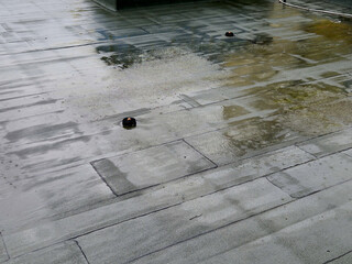 asphalt foil roof insulation is best tested by flooding it with water. rainwater drainage channels must work. regularly check clogged dirt grids.