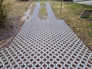 new established street in the city, the longitudinal parking lot is made of gray concrete...