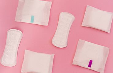 sanitary pads on a pink background. flat lay
