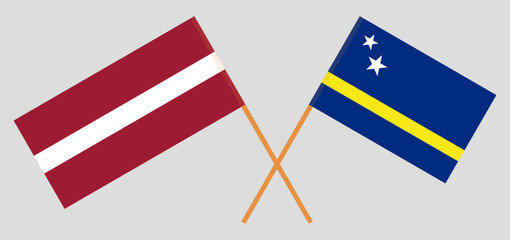 Crossed flags of Latvia and Country of Curacao. Official colors. Correct proportion