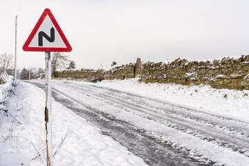 Road sign on a country road in Northumberland, UK in winter © hatheyphotos