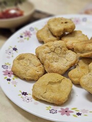 Delight in the wholesome goodness of homemade air-fried chicken nuggets with this enticing close-up. Each tender piece, golden and crispy, promises a healthier alternative to traditional frying.