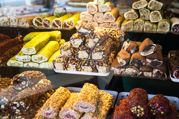 Photo of Turkish sweets through the glass of a store window.