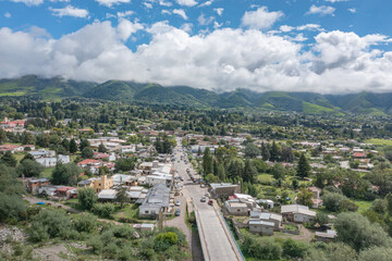 Fototapeta na wymiar Aerial view of the bridge over the Tafi River in Tafi del Valle Tucuman.