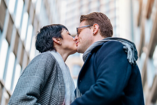 lovely Handsome man and beautiful woman falling in love, hugging each other as they walk around the city, having a fun time, lifestyle photo