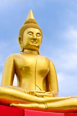 golden buddha statue on sky background in buddhist temple  ,Thailand