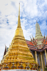 beautiful sanctuary and golden pagoda in ancient buddhist temple on blue sky background ,Thailand