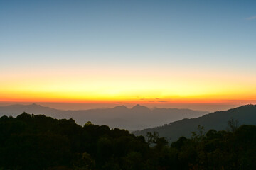 colorful view of sky shed from the sun rises near mountain ,thailand