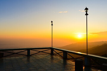  silhouette of lamp and  the sunrise at the viewpoint in national park,Thailand