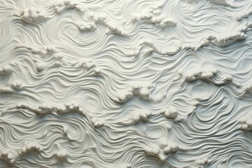 Overhead shot of foamy sea waves, forming intricate lace-like patterns on the surface