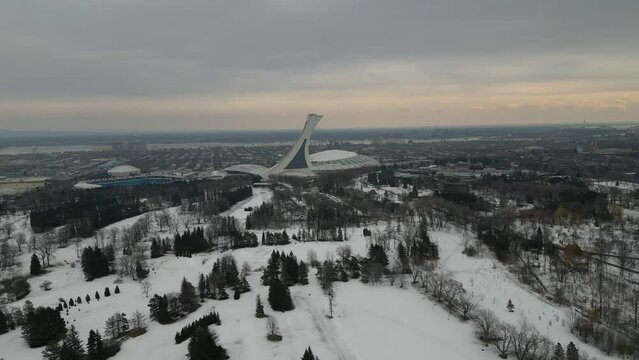 Montreal Winter Drone view of Olympic Stadium over Parc Maisonneuve