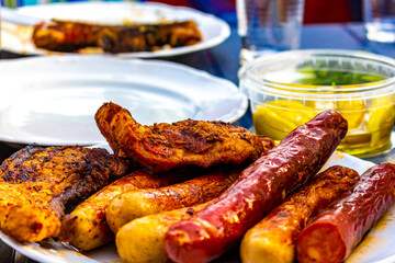 Grilled meat and bratwurst on a plate in Germany.