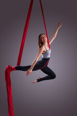 A female gymnast on gymnastic canvases