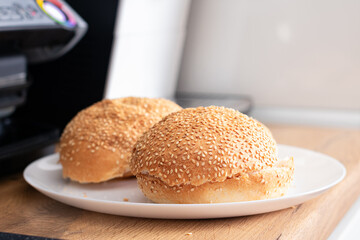 Hamburger bun on the kitchen table. Cooking homemade hamburgers. Burger