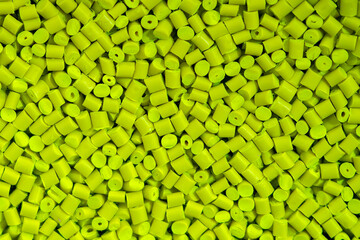 The pile of green pellets materials for plastic injection process.