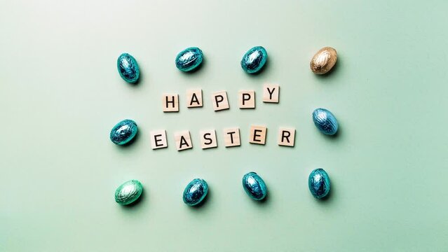 Happy easter text and chocolate eggs stop motion, stock video footage 4k