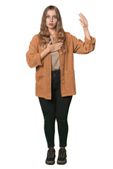 Studio portrait of a blonde Caucasian woman taking an oath, putting hand on chest.