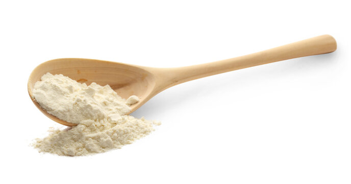 White wheat flour in wooden spoon