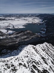 Drone shots at Herzogstand in Bavaria near the Alps, with snow-covered mountains, lakes and landscapes in the background