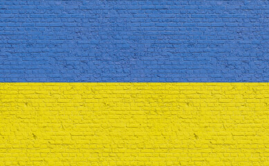 Ukraine  flag colors painted on a brick wall. National colors, country, banner, government, Ukrainian culture, politics.