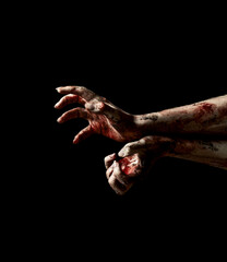Creepy hands of undead with dripping blood over black background