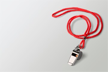 One metal steel whistle with colored cord
