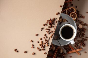 Black coffee  with spices on a beige background.