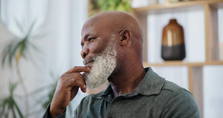 Thinking, remember and senior black man in a house with peaceful, moment or reflection. Questions, memory and African edlerly male person in living room thoughtful, mindful or nostalgic in retirement