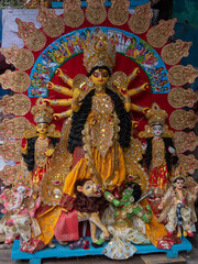 Fully decorated idol of Hindu Goddess Durga with use of selective focus. 