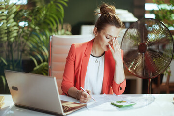 unhappy business owner woman in green office