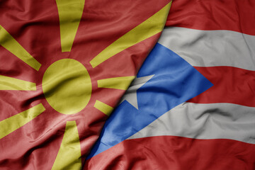 big waving national colorful flag of puerto rico and national flag of macedonia .